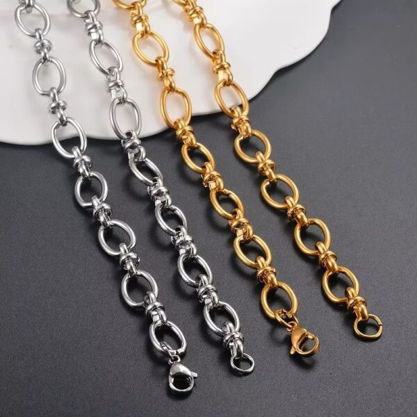 a group of gold and silver chains necklace