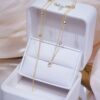 a jewelry box with a chain necklace in it