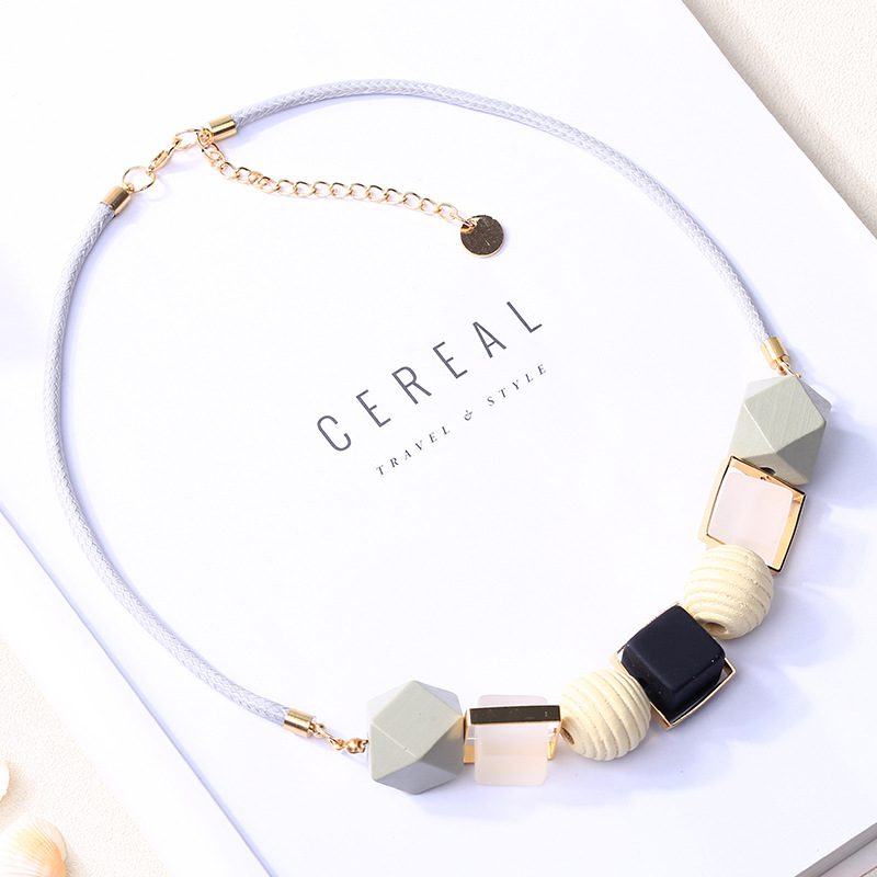 1636798031034 Discover the beauty of the pendant necklace made of unique colored woods.