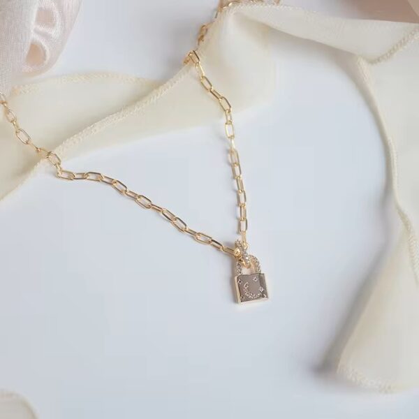Hcafd0b51e7e744f890f1480843b574faJ.jpg 640x640.jpg Xinbada 14k Real Gold Chain Fine Jewelry Small Lock Micro-inlaid Zircon Star and Moon Daily Clavicle Chain Necklaces for Woman