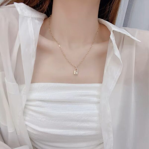 a woman chain wearing a white shirt